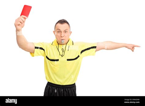 Angry Football Referee In A Yellow Jersey Showing A Red Card And