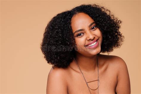 Happy Smiling Afro Woman Looking At Camera Posing On Beige Studio