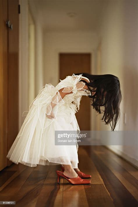 Child Tries On Her Mothers Shoes High Res Stock Photo Getty Images