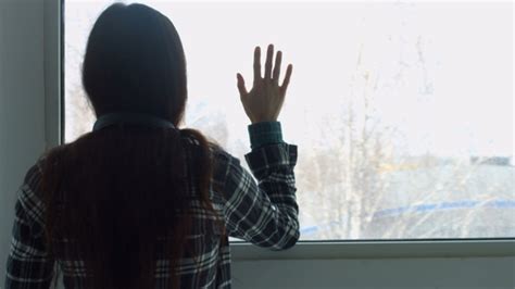 Sad Depressed Young Woman Looking Through Window Stock Footage Videohive