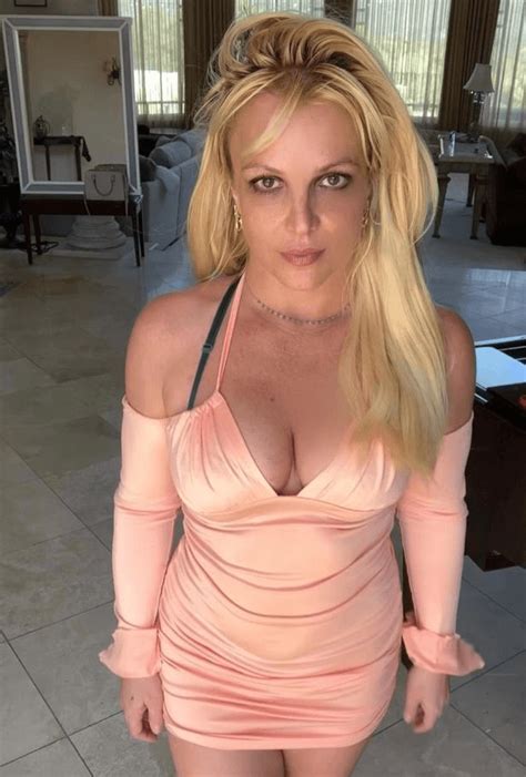 In A Plunging Dress Britney Spears Showcases Her Iconic Curves