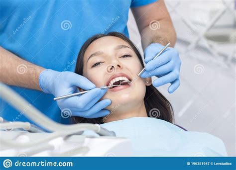 Dentist And Patient In The Dental Office Woman Having Teeth Examined Stock Image Image Of