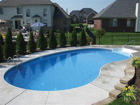 It can provide a more natural placement of a shallow end and it has deep end for swimmers. Waterfalls in the retaining wall make this Kidney shaped ...