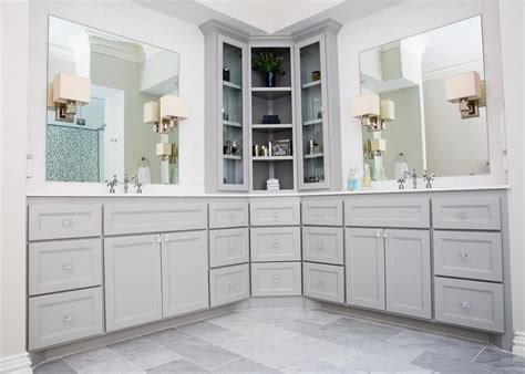 These bathroom furniture solutions allow you to store upwards. This remodeled bathroom features custom cabinetry with a ...