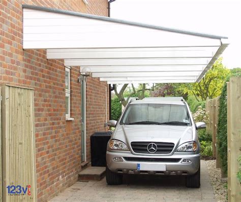 Cantilever carport on the driveway to provide protection to cars or provide extra storage. Carports and canopy Installations in the uk