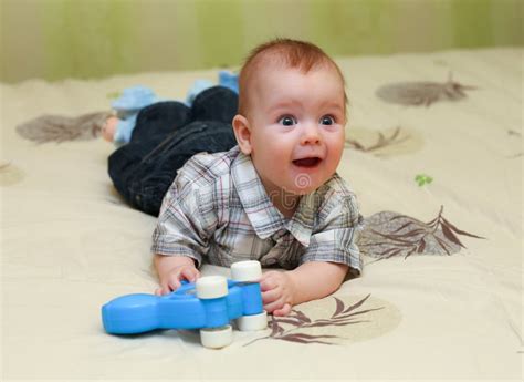 Funny Pleased Little Boy Lying Bed His Toy Stock Photos Free