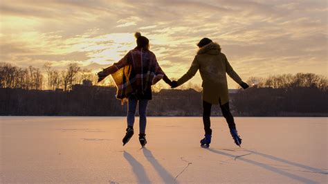 Couple Skating On Frozen Lake Stock Photo Download Image Now Istock