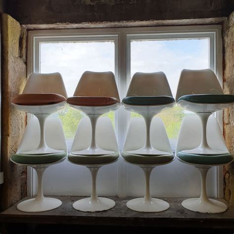 Eero saarinen is the creator of the tulip table. Vintage Saarinen Style White Tulip Chairs