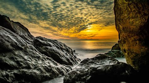 Download Wallpaper 2560x1440 Stones Rocks Sea Horizon Evening