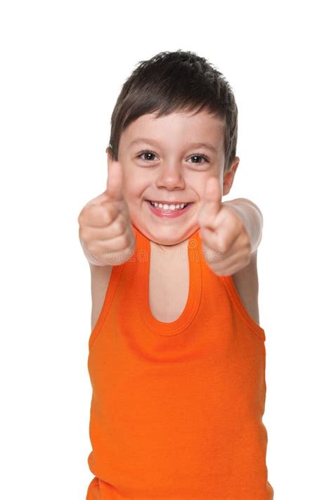 Happy Little Boy Holds His Thumbs Up Stock Photo Image Of Orange