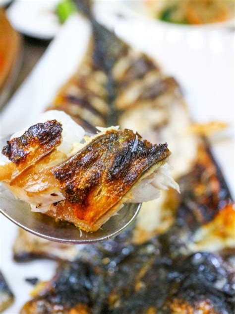 A Photo Of A Grilled Fish Removed With Chopsticks Stock Image Image