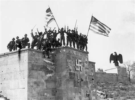 American Soldiers From The 45th Infantry Division Celebrate Atop The