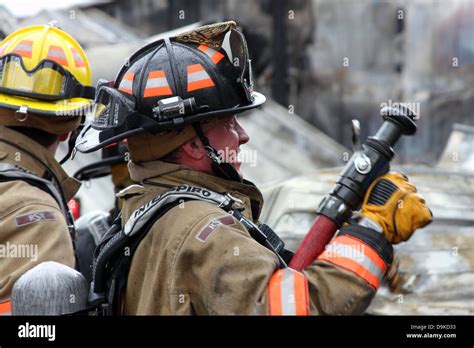 Firefighters On The Scene Of A Fire Stock Photo Alamy