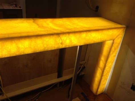 Bar area installation included a semi precious agate stone countertop, fabric sandwiched backsplash and custom pullouts for alcohol. Backlit honey onyx bar - Contemporary - Basement - dc ...