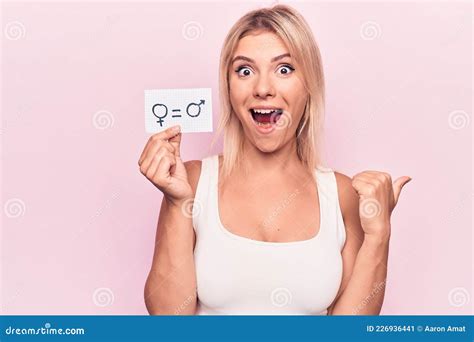 Young Blonde Woman Asking For Sex Discrimination Holding Paper With Gender Equality Message