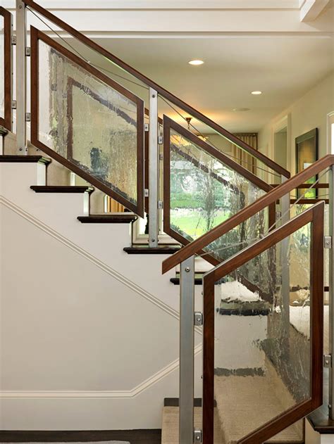 Modern curved staircase with glass railing. 50 Staircase Railing Ideas | Home Design Lover
