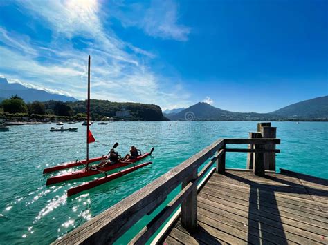 Kayak Boat And Wooden Jetty On Lake Annecy Editorial Photography