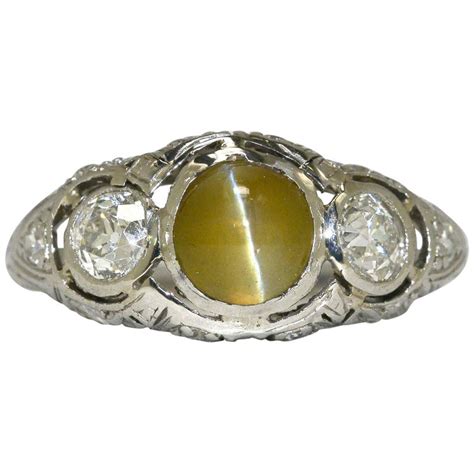 Cat's eye or lehsunia is a brilliant stone which resembles the eyes of a cat. Cats Eye Chrysoberyl Diamond 3-Stone Trinity Antique ...