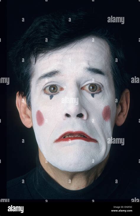 Mime Male In White Face Displaying Fear Or Sadness Stock Photo Alamy