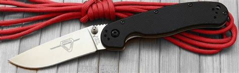A Knife With Red Cord Attached To It