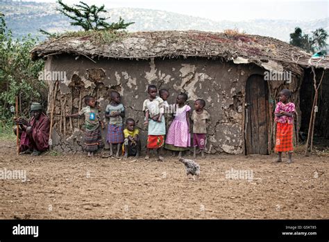 Group Of Small Children Outside A Mud Hut In The Masai Village Kenya
