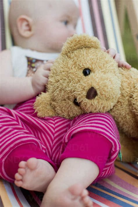 Baby Girl Holding Teddy Bear Stock Photo