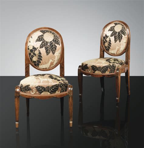 A Pair Of Carved Mahogany Chairs With Period Silk Upholstery By Louis