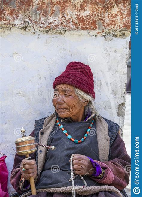 Old Buddhist Woman On The Street Next To The Monastery Lamayuru In