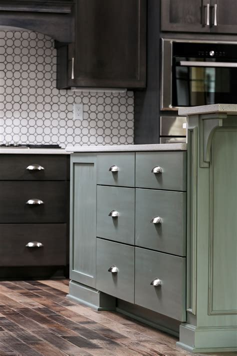 Choose an option below to learn more about how stain colors help create design harmony throughout your home. Dark and green stained kitchen cabinets with Tennessee Hardwood Flooring. Designed and built by ...