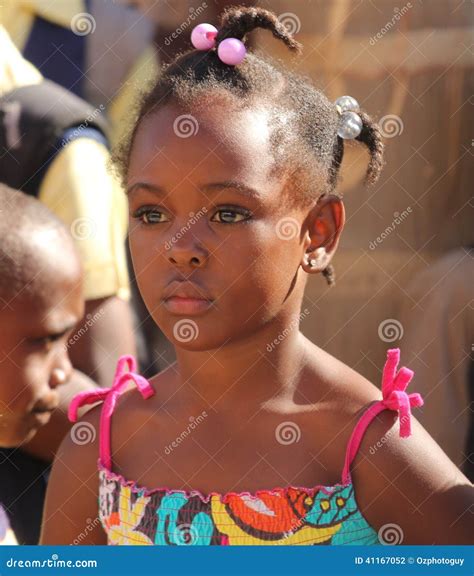 Jamaican School Girls Wide Brown Eyes Shy Little Sister Leaning On Shoulder Of Older Sister