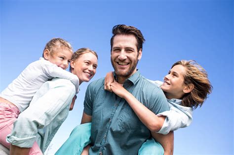 Happy Parents With Their Children Stock Photo Download Image Now Istock