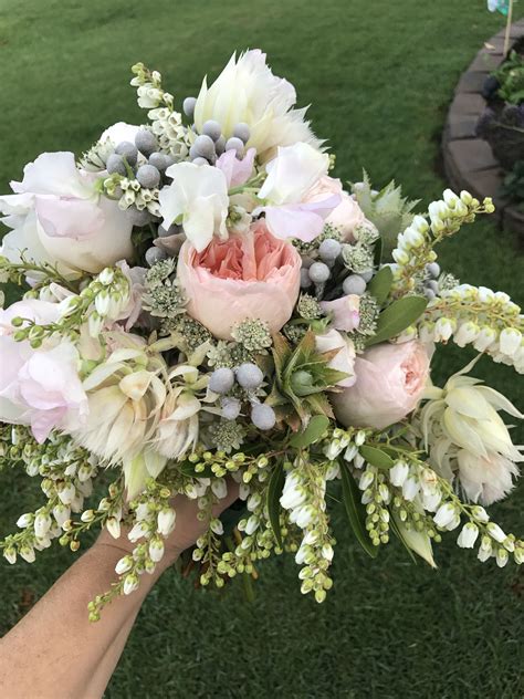 Sep 12, 2016 · the soft and delicate colors included within this bouquet are made up of coral roses and white peonies, accented by pale green poppy pods, eucalyptus leaves, and artichoke. Pale pinks and white bridal bouquet. Blushing bride protea ...