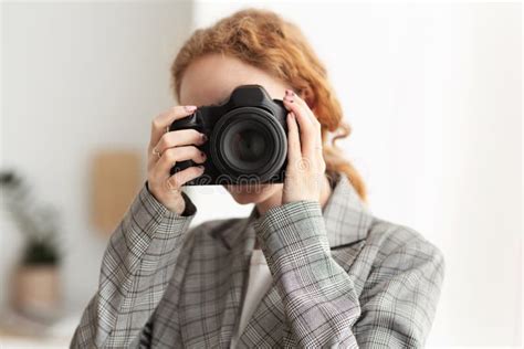 Successful Photographer Taking Photo With Professional Camera Stock