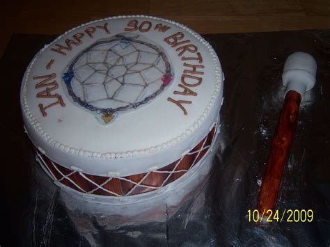 A Birthday Cake With The Words Happy 30th On It And A Wooden Stick Next