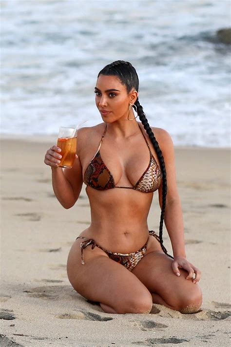 Kim Kardashian Shows Off Her Curves In A Snakeskin Print Bikini After