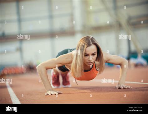 Young Athletic Woman Doing Exercises Doing Push Ups Stock Photo Alamy