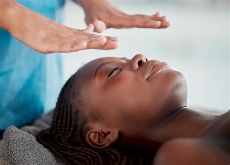 Premium Photo Black Woman Reiki Massage And Luxury Spa Treatment Of A Young Female Ready For