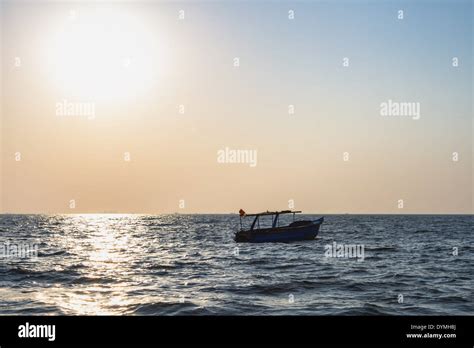 Fishermans Boat At Arabian Sea Sun Over Sea Stock Photo Alamy