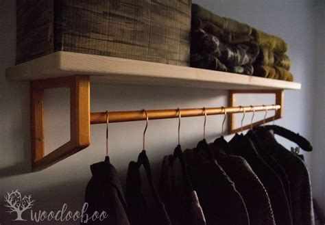 Clean lines and an airy appearance form the. Wall shelf with hanging rod, bathroom towel rod, clothes ...