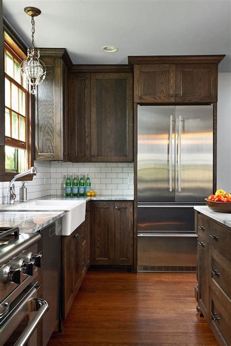When you decorate your kitchen and select an interior design the kitchen layout is the floor plan that shows smart placements of the kitchen island, cabinets combine white with black, brown or grey hues. 7 Beautiful Dark and Light Brown Kitchen Cabinet Ideas ...