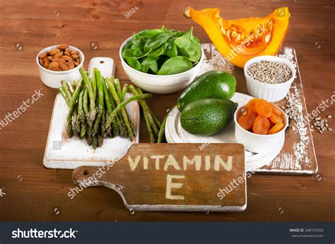 Foods Containing Vitamin E On A Wooden Board View From Above Stock