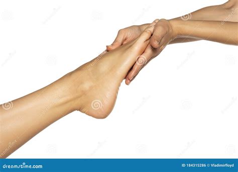 Woman`s Hand Holding Female Feet On White Stock Photo Image Of
