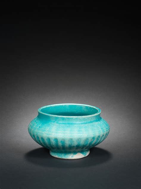 bonhams a moulded monochrome pottery bowl persia 12th 13th century
