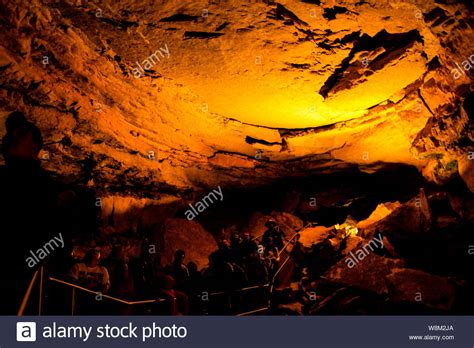 Tourists Enjoying Cave Tour Inside Mammoth Caves National Park Stock