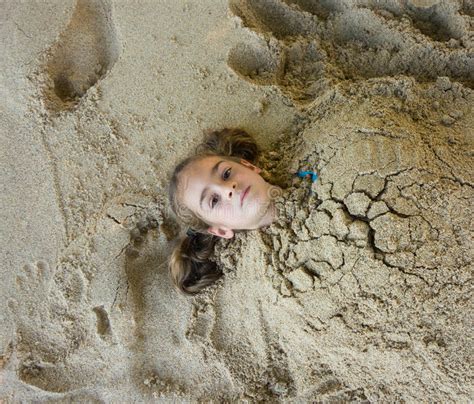 A Buried In Sand On A Beach In The Windward Islands Stock