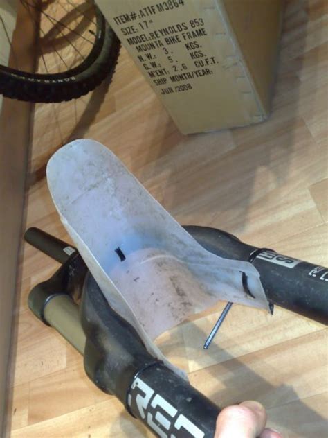 Just cheap plastic folder, some scissors and a couple loose zip ties. Amazing! I want one! DIY front fender! - Singletrack Magazine