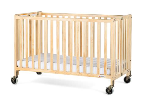 The mattress should fit perfectly into the crib base: Foundations HideAway Full-Size Portable Wood Crib with ...