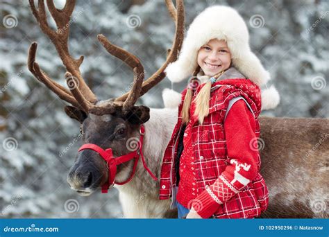 Winter Playtimehappy Little Girl Hugging Her Reindeer Stock Photo