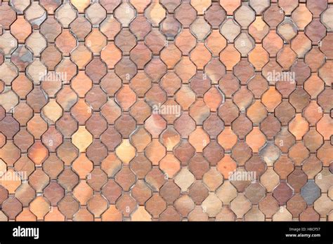Surface Of The Brown Tiles Wall For The Design Background Stock Photo