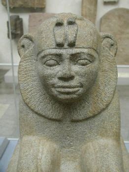An Ancient Statue Is On Display In A Museum
